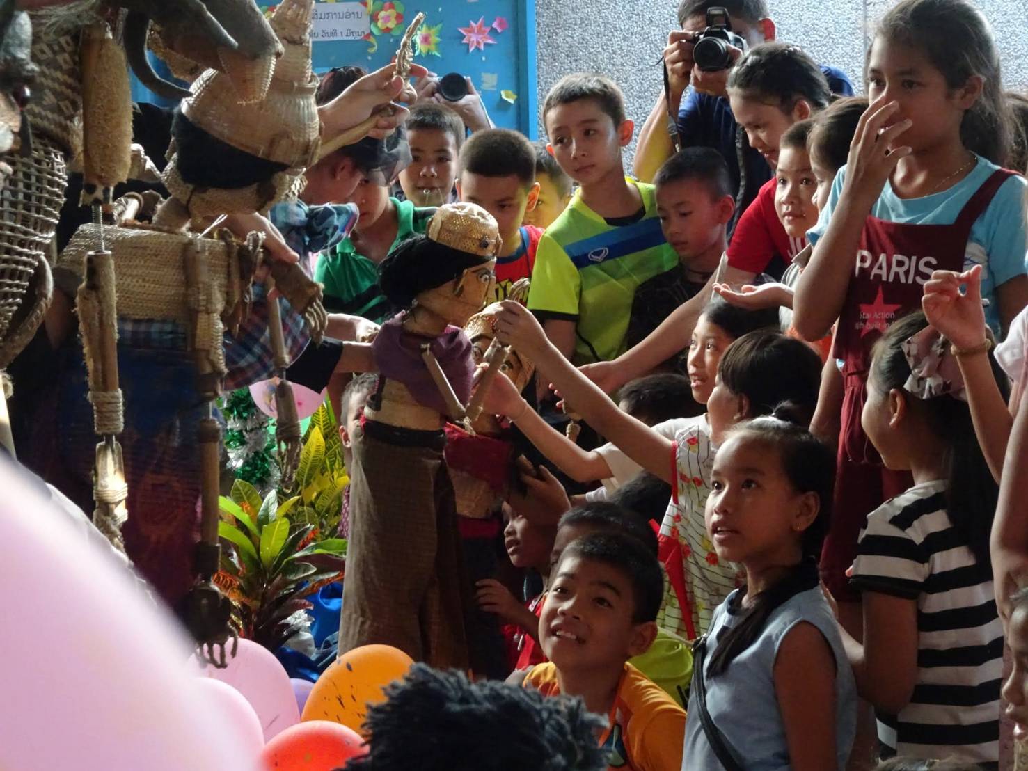 Children interacting with puppets