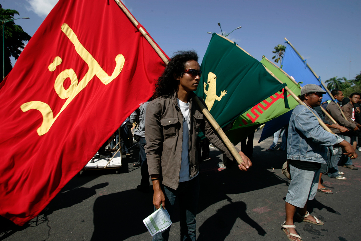 Community members holding up flags